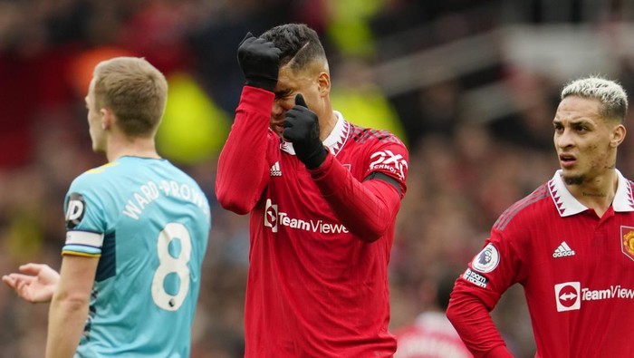 Manchester Uniteds Casemiro reacts after being shown a red card by referee Anthony Taylor during the English Premier League soccer match between Manchester United and Southampton at Old Trafford stadium in Manchester, England, Sunday, March 12, 2023. (AP Photo/Jon Super)