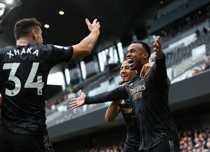 Soccer Football - Premier League - Fulham v Arsenal - Craven Cottage, London, Britain - March 12, 2023 Arsenals Gabriel celebrates scoring their first goal with William Saliba and Granit Xhaka REUTERS/David Klein EDITORIAL USE ONLY. No use with unauthorized audio, video, data, fixture lists, club/league logos or live services. Online in-match use limited to 75 images, no video emulation. No use in betting, games or single club /league/player publications.  Please contact your account representative for further details.