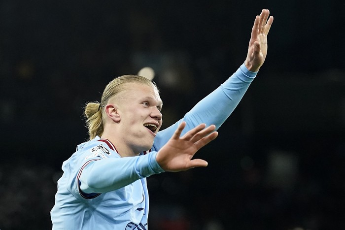Manchester Citys Erling Haaland reacts after he scored his 5th goal, the 6-0, during the Champions League round of 16 second leg soccer match between Manchester City and RB Leipzig at the Etihad stadium in Manchester, England, Tuesday, March 14, 2023. (AP Photo/Dave Thompson)
