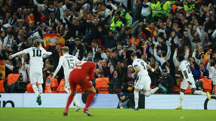 Soccer Football - Champions League - Round of 16 First Leg - Liverpool v Real Madrid - Anfield, Liverpool, Britain - February 21, 2023  Real Madrids Karim Benzema celebrates scoring their fifth goal REUTERS/Phil Noble