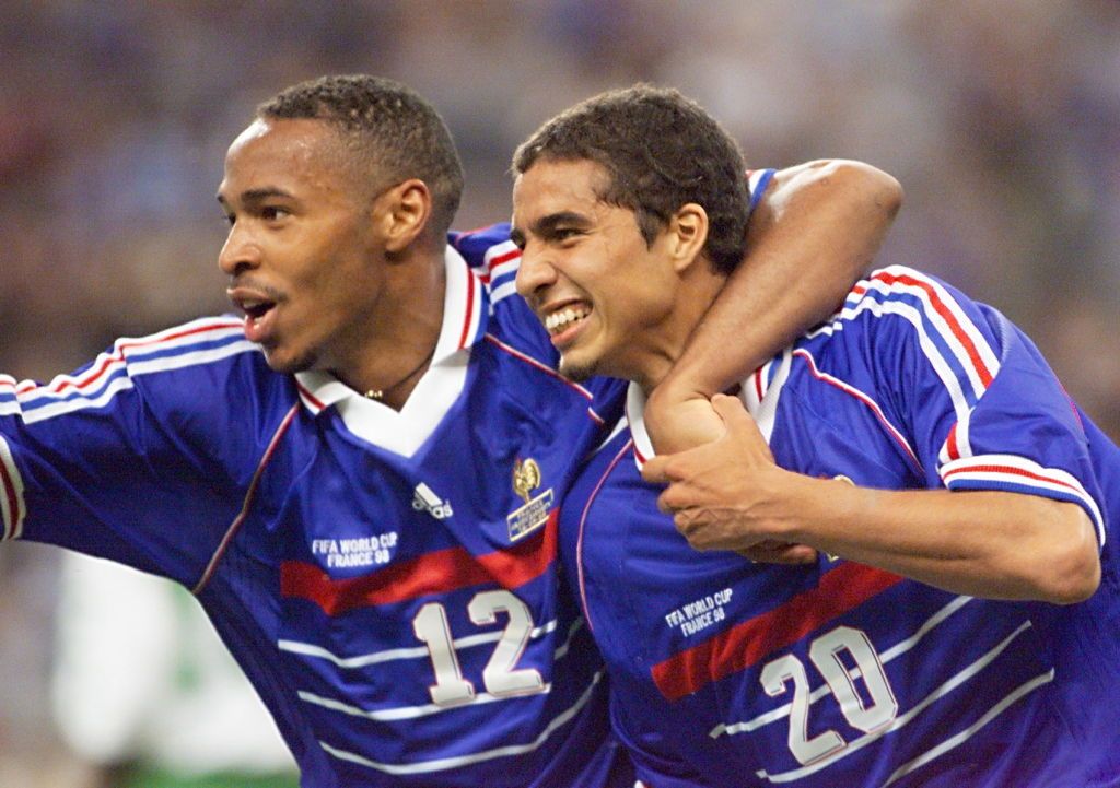 French forward David Trezeguet (R) is greeted by Thierry Henry after he scored the 2nd goal,18 June at the Stade de France in Saint-Denis, during the 1998 Soccer World Cup group C match between France and Saudi Arabia. France beat Saudi Arabia 4-0.  (ELECTRONIC IMAGE) (Photo by Pedro UGARTE / AFP)        (Photo credit should read PEDRO UGARTE/AFP via Getty Images)