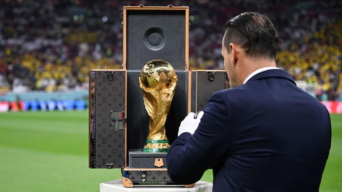 AL KHOR, QATAR - NOVEMBER 20: The FIFA World Cup Trophy is brought out prior to the FIFA World Cup Qatar 2022 Group A match between Qatar and Ecuador at Al Bayt Stadium on November 20, 2022 in Al Khor, Qatar. (Photo by Michael Regan - FIFA/FIFA via Getty Images)