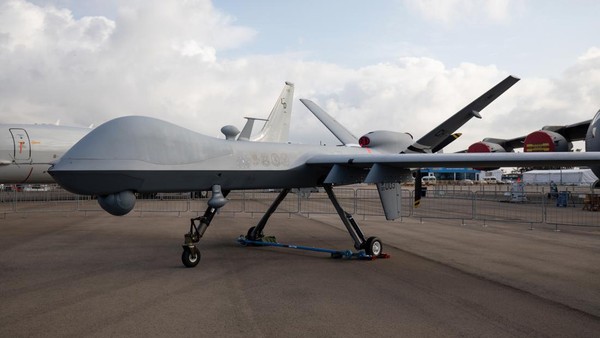 A U.S. Air Force MQ-9 Reaper unmanned aerial vehicle (UAV) drone, manufactured by General Atomics Aeronautical Systems Inc, stands on display during the Singapore Airshow at the Changi Exhibition Centre in Singapore, on Tuesday, Feb. 11, 2020. Planemakers and airlines are exploring new designs to reduce fuel burn and cut carbon emissions in a warming climate. Blending the wings with the fuselage to cut drag is one of several possible solutions. Photographer: SeongJoon Cho/Bloomberg via Getty Images