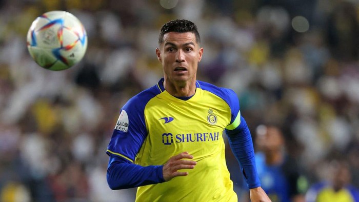 Nassrs Portuguese forward Cristiano Ronaldo looks on as he runs after ball during the King Cup quarter-final football match between al-Nassr and Abha at Mrsool Park Stadium in Riyadh on March 14, 2023. (Photo by Fayez NURELDINE / AFP) (Photo by FAYEZ NURELDINE/AFP via Getty Images)