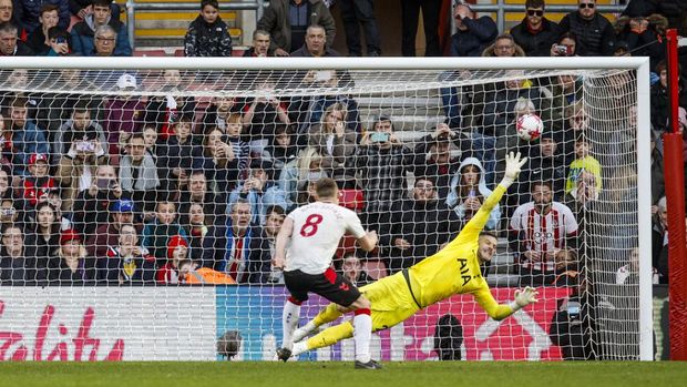 Southampton's James Ward-Prowse scores his side's third goal from the penalty spot during the English Premier League soccer match between Southampton and Tottenham at St Mary's Stadium in Southampton, England, Saturday, March 18, 2023. (AP Photo/David Cliff)