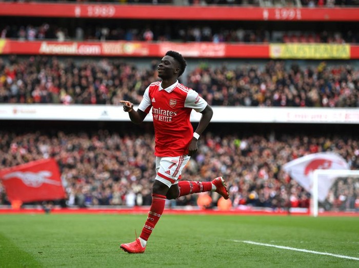 LONDON, ENGLAND - MARCH 19: Bukayo Saka of Arsenal celebrates after scoring the team's second goal during the Premier League match between Arsenal FC and Crystal Palace at Emirates Stadium on March 19, 2023 in London, England. (Photo by Shaun Botterill/Getty Images)