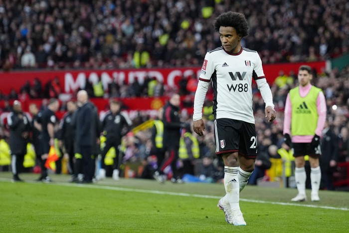 Fulhams Willian walks off after he was shown a red card during the English FA Cup quarterfinal soccer match between Manchester United and Fulham at the Old Trafford stadium in Manchester, England, Sunday, March 19, 2023. (AP Photo/Jon Super)