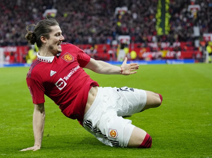 Manchester Uniteds Marcel Sabitzer celebrates after scoring his sides second goal during the English FA Cup quarterfinal soccer match between Manchester United and Fulham at the Old Trafford stadium in Manchester, England, Sunday, March 19, 2023. (AP Photo/Jon Super)