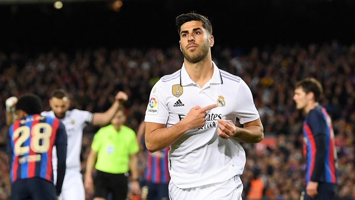 Real Madrids Spanish midfielder Marco Asensio celebrates after scoring a goal that was later annulled during the Spanish league football match between FC Barcelona and Real Madrid CF at the Camp Nou stadium in Barcelona on March 19, 2023. (Photo by Josep LAGO / AFP) (Photo by JOSEP LAGO/AFP via Getty Images)