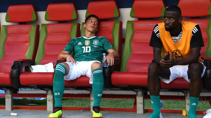 KAZAN, RUSSIA - JUNE 27:  Mesut Oezil of Germany and Antonio Ruediger of Germany look dejected following their sides defeat in the 2018 FIFA World Cup Russia group F match between Korea Republic and Germany at Kazan Arena on June 27, 2018 in Kazan, Russia.  (Photo by Michael Regan - FIFA/FIFA via Getty Images)