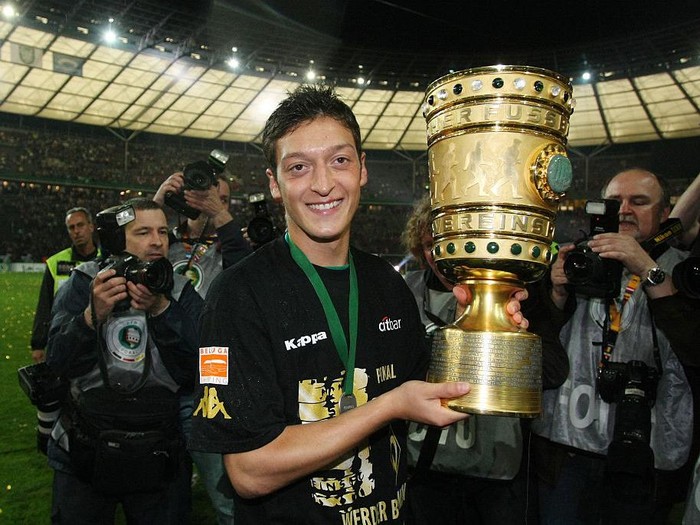 Mesut Oezil with the trophy after Bremen won the German DFB Cup finals 1-0 due to his goal (Photo by sampics/Corbis via Getty Images)
