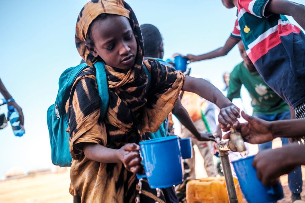 Children collect water at a school in the camp for internally displaced people of Farburo in the village of Adlale, near the city of Gode, Ethiopia, on January 11, 2023. - The last five rainy seasons since the end of 2020 have failed, triggering the worst drought in four decades in Ethiopia, Somalia and Kenya. And the next rainy season, from March to May, is also expected to be below average. According to the UN, drought has plunged 12 million people into 