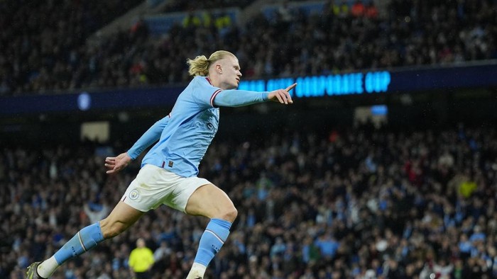 Manchester Citys Erling Haaland celebrates after scoring his sides opening goal during the English FA Cup quarter final soccer match between Manchester City and Burnley at the Etihad stadium in Manchester, England, Saturday, March 18, 2023. (AP Photo/Jon Super)