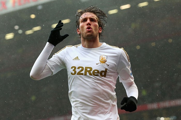 MANCHESTER, ENGLAND - MAY 12:  Miguel Michu of Swansea City celebrates scoring his teams first goal to make the score 1-1 during the Barclays Premier League match between Manchester United and Swansea City at Old Trafford on May 12, 2013 in Manchester, England.  (Photo by Alex Livesey/Getty Images)