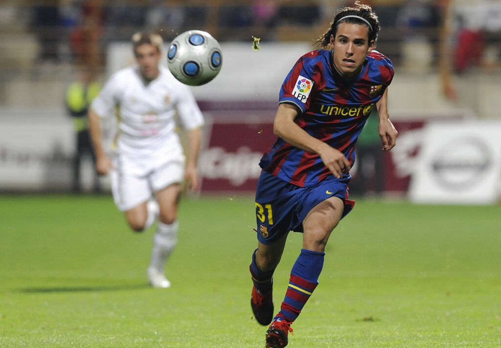 FC Barcelona player Gai Yigaal Assulin, right, from Israel, duels for the ball with Girona player Eloi Amagat during their Catalunya cup semifinal at the Nou Municipal Palamos Stadium in Palamos, Spain, Wednesday, Sept. 5, 2007. (AP Photo/Manu Fernandez)
