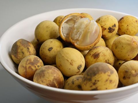 Langsat, Lansium parasiticum, is a species of tree in the Mahogany family with commercially cultivated edible fruits, native to S.E. Asia