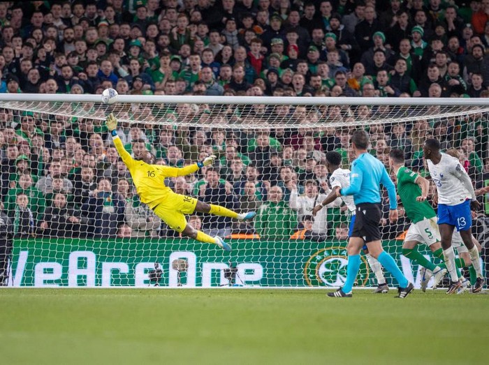 DUBLIN, IRELAND:  March 27:  Goalkeeper Mike Maignan #16 of France makes a fine save late in the game from a Nathan Collins #12 of the Republic of Ireland header during the Republic of Ireland V France, 2024 European Championship Qualifying, Group B match at Aviva Stadium on March 27, 2023, in Dublin, Ireland. (Photo by Tim Clayton/Corbis via Getty Images)