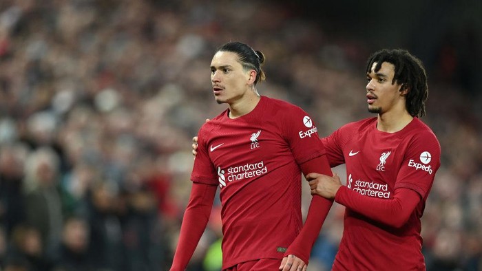 LIVERPOOL, ENGLAND - MARCH 05: Darwin Nunez of Liverpool is held by Trent Alexander-Arnold as they confront the linesman during the Premier League match between Liverpool FC and Manchester United at Anfield on March 05, 2023 in Liverpool, England. (Photo by Michael Regan/Getty Images)