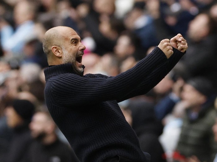 Soccer Football - Premier League - Manchester City v Liverpool - Etihad Stadium, Manchester, Britain - April 1, 2023  Manchester City manager Pep Guardiola celebrates their first goal scored by Julian Alvarez Action Images via Reuters/Jason Cairnduff EDITORIAL USE ONLY. No use with unauthorized audio, video, data, fixture lists, club/league logos or 'live' services. Online in-match use limited to 75 images, no video emulation. No use in betting, games or single club /league/player publications.  Please contact your account representative for further details.