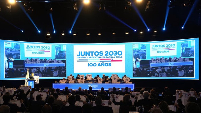 Presidents of South American soccer associations hold T-shirts that show support for their campaign to host the 2030 World Cup in South America, at the 76th Conmebol Annual Congress in Luque, Paraguay, Friday, March 31, 2023. (AP Photo/Jorge Saenz)