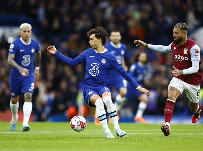 Soccer Football - Premier League - Chelsea v Aston Villa - Stamford Bridge, London, Britain - April 1, 2023 Chelsea's Joao Felix in action with Aston Villa's Douglas Luiz Action Images via Reuters/Peter Cziborra EDITORIAL USE ONLY. No use with unauthorized audio, video, data, fixture lists, club/league logos or 'live' services. Online in-match use limited to 75 images, no video emulation. No use in betting, games or single club /league/player publications.  Please contact your account representative for further details.