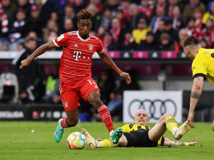 Soccer Football - Bundesliga - Bayern Munich v Borussia Dortmund - Allianz Arena, Munich, Germany - April 1, 2023 Bayern Munich's Kingsley Coman in action with Borussia Dortmund's Marius Wolf REUTERS/Lukas Barth DFL REGULATIONS PROHIBIT ANY USE OF PHOTOGRAPHS AS IMAGE SEQUENCES AND/OR QUASI-VIDEO.