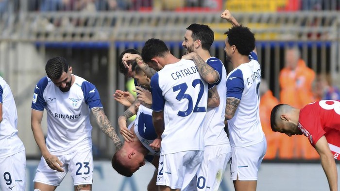 Lazios Sergej Milinkovic-Savic, head down, celebrates with teammates after scoring his sides 2nd goal during the Serie A soccer match between Monza and Lazio at the U-Power stadium in Monza, Italy, Sunday, April 3, 2023. (Claudio Grassi/LaPresse via AP)