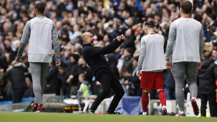 Soccer Football - Premier League - Manchester City v Liverpool - Etihad Stadium, Manchester, Britain - April 1, 2023  Manchester City manager Pep Guardiola celebrates their first goal scored by Julian Alvarez Action Images via Reuters/Jason Cairnduff EDITORIAL USE ONLY. No use with unauthorized audio, video, data, fixture lists, club/league logos or 'live' services. Online in-match use limited to 75 images, no video emulation. No use in betting, games or single club /league/player publications.  Please contact your account representative for further details.