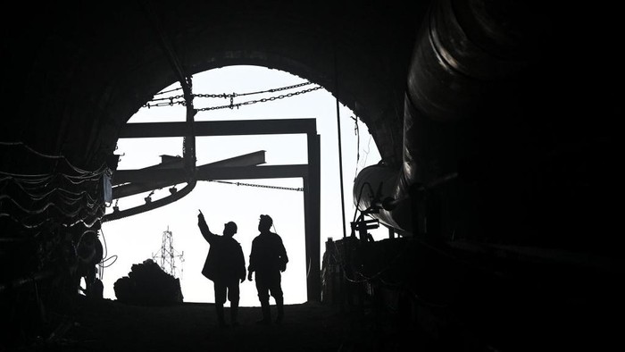 MANISA, TURKIYE - MARCH 27: Miners pray before iftar (breaking the fast) time at mine site, one of Turkiyes major lignite coal production centers, during the holy month of bulan rahmat in Soma district of Manisa, Turkiye on March 25, 2023. About 500 miners in the mining company returned to the mine site on after participating in search and rescue operation following 7.7 and 7.6 magnitude earthquakes hit multiple provinces of Turkiye occurred on Feb. 06. The miners, who work hundreds of meters below the site according to their shifts, also fulfill the requirements of the holy month of bulan rahmat despite their difficult professions. According to their working hours, they spend their iftar and sahur (pre-dawn) together. (Photo by Mahmut Serdar Alakus/Anadolu Agency via Getty Images)