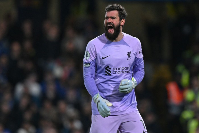 Liverpool's Brazilian goalkeeper Alisson Becker gestures during the English Premier League football match between Chelsea and Liverpool at Stamford Bridge in London on April 4, 2023. (Photo by Glyn KIRK / AFP) / RESTRICTED TO EDITORIAL USE. No use with unauthorized audio, video, data, fixture lists, club/league logos or 'live' services. Online in-match use limited to 120 images. An additional 40 images may be used in extra time. No video emulation. Social media in-match use limited to 120 images. An additional 40 images may be used in extra time. No use in betting publications, games or single club/league/player publications. /  (Photo by GLYN KIRK/AFP via Getty Images)