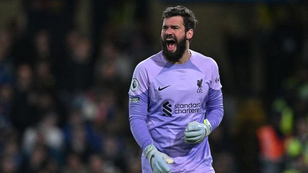 Liverpool's Brazilian goalkeeper Alisson Becker gestures during the English Premier League football match between Chelsea and Liverpool at Stamford Bridge in London on April 4, 2023. (Photo by Glyn KIRK / AFP) / RESTRICTED TO EDITORIAL USE. No use with unauthorized audio, video, data, fixture lists, club/league logos or 'live' services. Online in-match use limited to 120 images. An additional 40 images may be used in extra time. No video emulation. Social media in-match use limited to 120 images. An additional 40 images may be used in extra time. No use in betting publications, games or single club/league/player publications. / (Photo by GLYN KIRK/AFP via Getty Images)