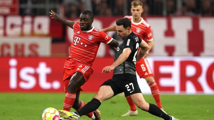 MUNICH, GERMANY - APRIL 04: Dayot Upamecano of FC Bayern Munich battles for possession with Nicolas Hoefler of Sport-Club Freiburg during the DFB Cup quarterfinal match between FC Bayern München and SC Freiburg at Allianz Arena on April 04, 2023 in Munich, Germany. (Photo by Alexander Hassenstein/Getty Images)