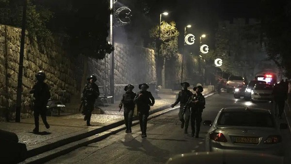 Israeli Border Police are deployed near the Lions Gate to the Old City of Jerusalem during a raid by police of Al-Aqsa Mosque, Wednesday, April 5, 2023. Palestinian media reported police attacked Palestinian worshippers, raising fears of wider tension as Islamic and Jewish holidays overlap. (AP Photo/Mahmoud Illean)