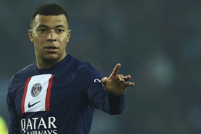 PSGs Kylian Mbappe gestures during the French League One soccer match between Paris Saint-Germain and Lyon at the Parc des Princes stadium in Paris, Sunday, April 2, 2023. (AP Photo/Aurelien Morissard)