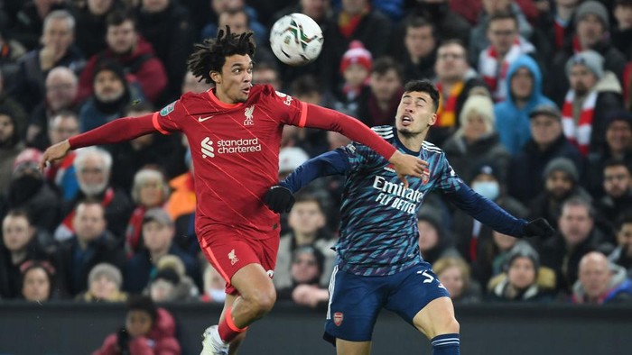 LIVERPOOL, ENGLAND - JANUARY 13: Gabriel Martinelli of Arsenal challneged by Trent Alexander-Arnold of Liverpool during the Carabao Cup Semi Final First Leg match between Liverpool and Arsenal at Anfield on January 13, 2022 in Liverpool, England. (Photo by Stuart MacFarlane/Arsenal FC via Getty Images)