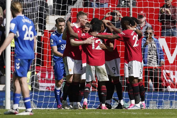 Manchester Uniteds Anthony Martial celebrates with his teammates after scoring his sides second goal during the English Premier League soccer match between Manchester United and Everton, at the Old Trafford stadium in Manchester, England, Saturday, April 8, 2023. (AP Photo/Dave Thompson)
