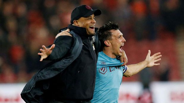 Soccer Football - Championship - Middlesbrough v Burnley - Riverside Stadium, Middlesbrough, Britain - April 7, 2023 Burnley manager Vincent Kompany celebrates promotion to the Premier League with Jack Cork Action Images via Reuters/Craig Brough  EDITORIAL USE ONLY. No use with unauthorized audio, video, data, fixture lists, club/league logos or 