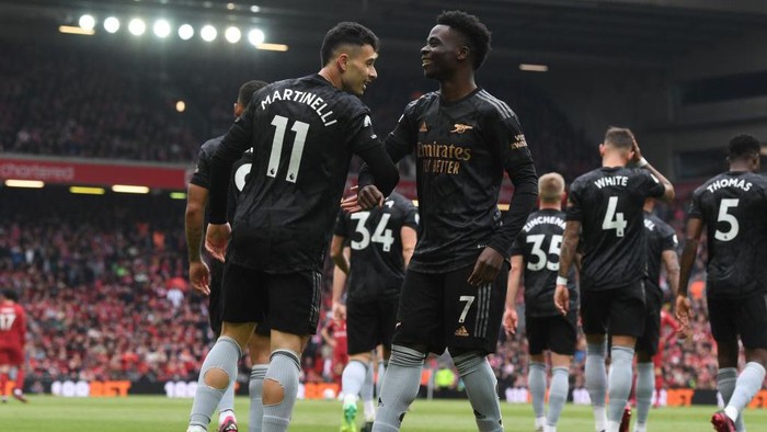 LIVERPOOL, ENGLAND - APRIL 09: (L) Gabriel Martinelli celebrates scoring the 1st Arsenal goal with (R) Bukayo Saka during the Premier League match between Liverpool FC and Arsenal FC at Anfield on April 09, 2023 in Liverpool, England. (Photo by Stuart MacFarlane/Arsenal FC via Getty Images)