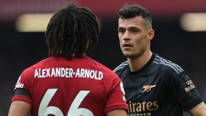LIVERPOOL, ENGLAND - APRIL 09: Granit Xhaka of Arsenal eyeballs Trent Alexander-Arnold of Liverpool during the Premier League match between Liverpool FC and Arsenal FC at Anfield on April 09, 2023 in Liverpool, England. (Photo by David Price/Arsenal FC via Getty Images)