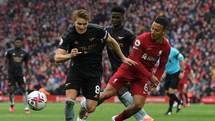 LIVERPOOL, ENGLAND - APRIL 09: Martin Odegaard of Arsenal takes on Thiago Alcantara of Liverpool during the Premier League match between Liverpool FC and Arsenal FC at Anfield on April 09, 2023 in Liverpool, England. (Photo by David Price/Arsenal FC via Getty Images)