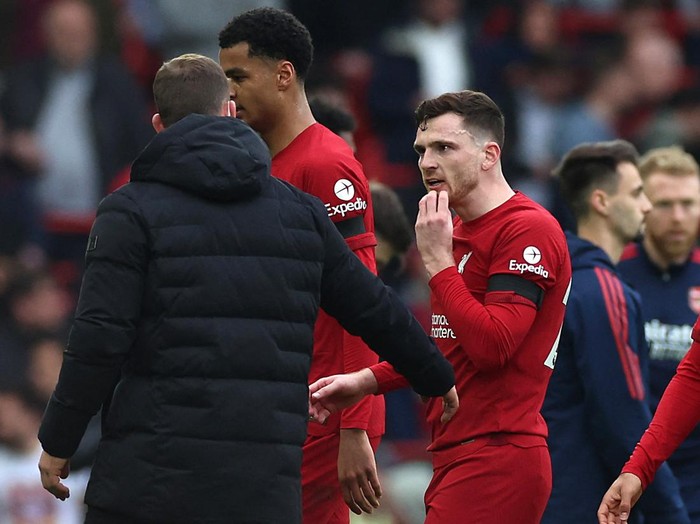 Soccer Football - Premier League - Liverpool v Arsenal - Anfield, Liverpool, Britain - April 9, 2023 Liverpool's Andrew Robertson reacts after being shown a yellow card by referee Paul Tierney at half time after clashing with assistant referee Constantine Hatzidakis REUTERS/Phil Noble EDITORIAL USE ONLY. No use with unauthorized audio, video, data, fixture lists, club/league logos or 'live' services. Online in-match use limited to 75 images, no video emulation. No use in betting, games or single club /league/player publications.  Please contact your account representative for further details.