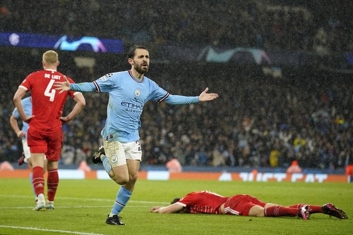 Manchester Citys Bernardo Silva celebrates after scoring his sides second goal during the Champions League quarterfinal, first leg, soccer match between Manchester City and Bayern Munich at the Etihad stadium in Manchester, England, Tuesday, April 11, 2023. (AP Photo/Dave Thompson)