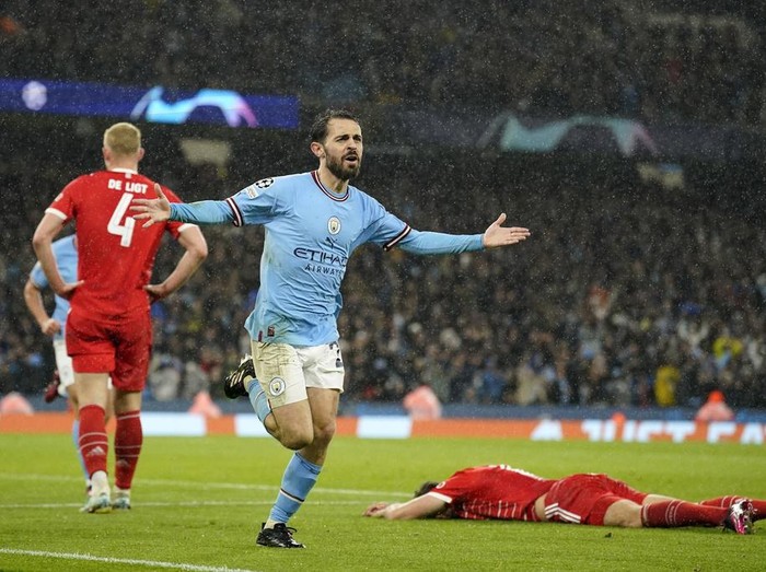 Manchester City's Bernardo Silva celebrates after scoring his side's second goal during the Champions League quarterfinal, first leg, soccer match between Manchester City and Bayern Munich at the Etihad stadium in Manchester, England, Tuesday, April 11, 2023. (AP Photo/Dave Thompson)