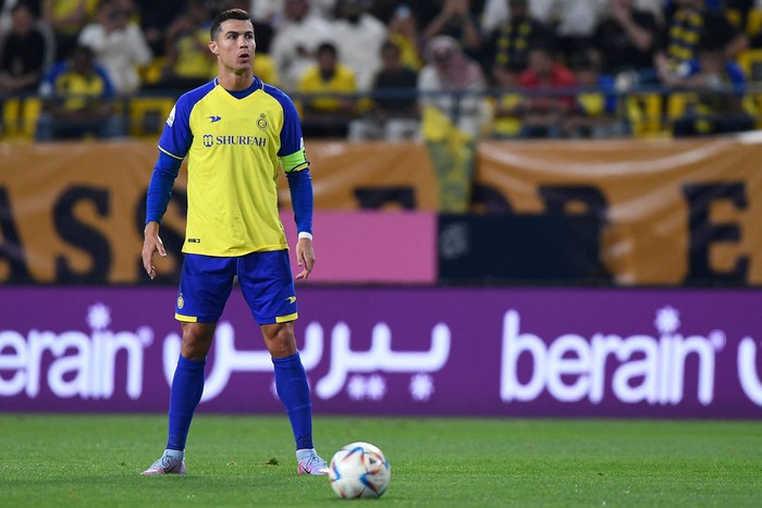 TOPSHOT - Nassrs Portuguese forward Cristiano Ronaldo stands over a free-kick during the Saudi Pro League football match between Al-Nassr and Al-Batin at the Mrsool Park Stadium in the Saudi capital Riyadh on March 3, 2023. (Photo by AFP) (Photo by -/AFP via Getty Images)