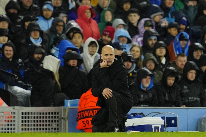 Manchester Citys head coach Pep Guardiola gestures during the Champions League quarterfinal, first leg, soccer match between Manchester City and Bayern Munich at the Etihad stadium in Manchester, England, Tuesday, April 11, 2023. (AP Photo/Jon Super)