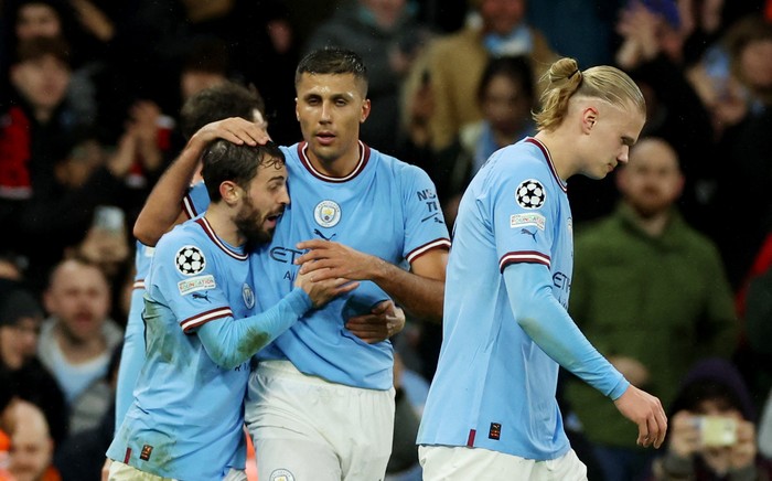 Soccer Football - Champions League - Quarter Final - First Leg - Manchester City v Bayern Munich - Etihad Stadium, Manchester, Britain - April 11, 2023 Manchester Citys Rodri celebrates scoring their first goal with Bernardo Silva and Erling Braut Haaland REUTERS/Phil Noble