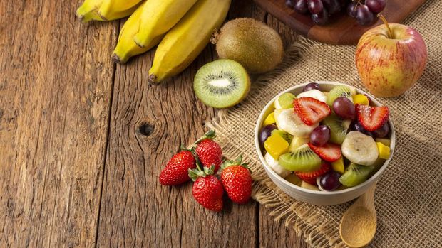 Fruit salad in bowl on the table.