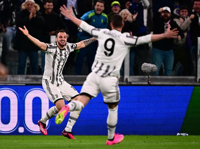 Juventus Italian defender Federico Gatti (L) celebrates after opening the scoring during the UEFA Europa League quarter-finals first leg football match between Juventus and Sporting CP, on April 13, 2023 at the Juventus stadium in Turin. (Photo by Marco BERTORELLO / AFP) (Photo by MARCO BERTORELLO/AFP via Getty Images)