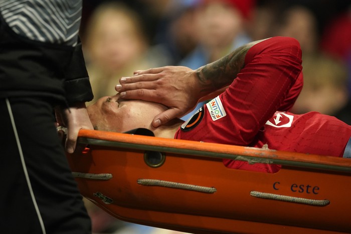 Lisandro Martinez Manchester United's Lisandro Martinez is carried on stretcher after suffering an injury during the Europa League first leg quarterfinal soccer match between Manchester United and Sevilla at the Old Trafford stadium in Manchester, Thursday, April 13, 2023. (AP Photo/Dave Thompson)