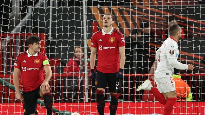 MANCHESTER, ENGLAND - APRIL 13: Harry Maguire of Manchester United reacts after scoring an own goal to make it 2-2 during the UEFA Europa League quarterfinal first leg match between Manchester United and Sevilla FC at Old Trafford on April 13, 2023 in Manchester, United Kingdom. (Photo by Matthew Ashton - AMA/Getty Images)